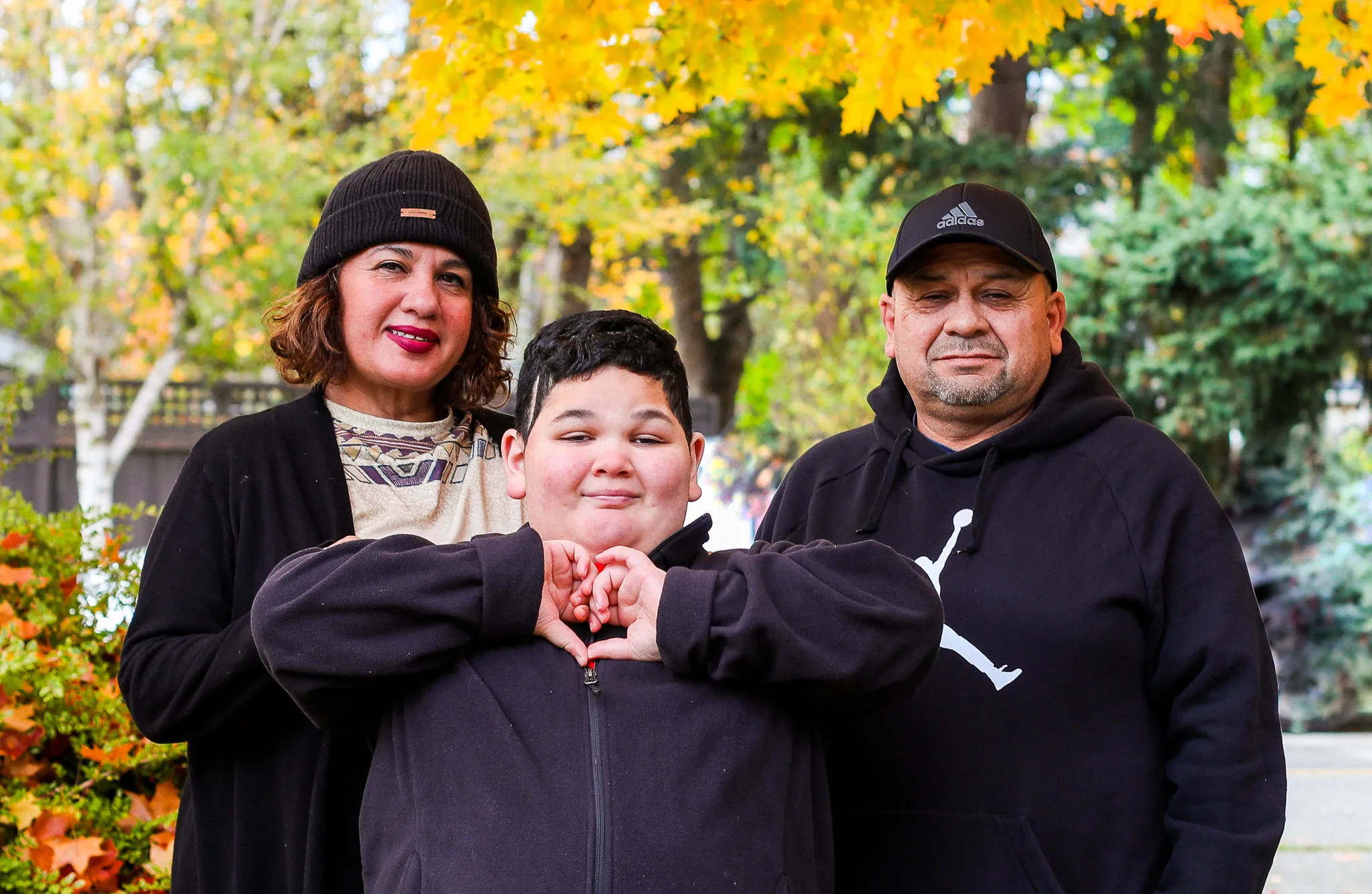 Matthew Sanchez and parents smiling outside