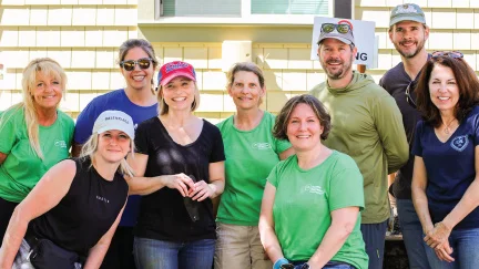 group of volunteers smiling together