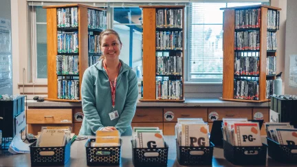 young female adult smiling as she volunteers her time at RMHC seattle